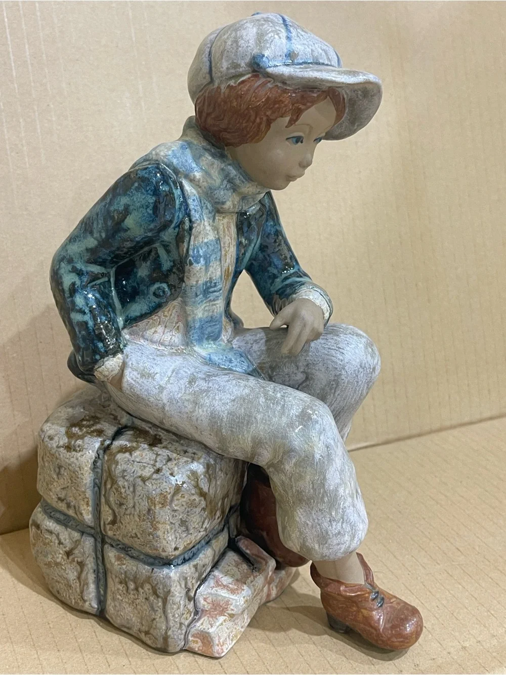 Kid Porcelian Sculpture “Sitting on Cargo” a Porcelana Artistica Levantina PAL